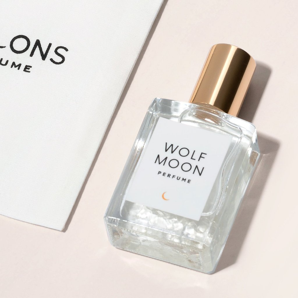 Wolf Moon Perfume - embrace your inner mystic with this sensual blend of vanilla and amber. The magic of Herkimer Diamond and Clear Quartz are included in each hand poured bottle of perfume.