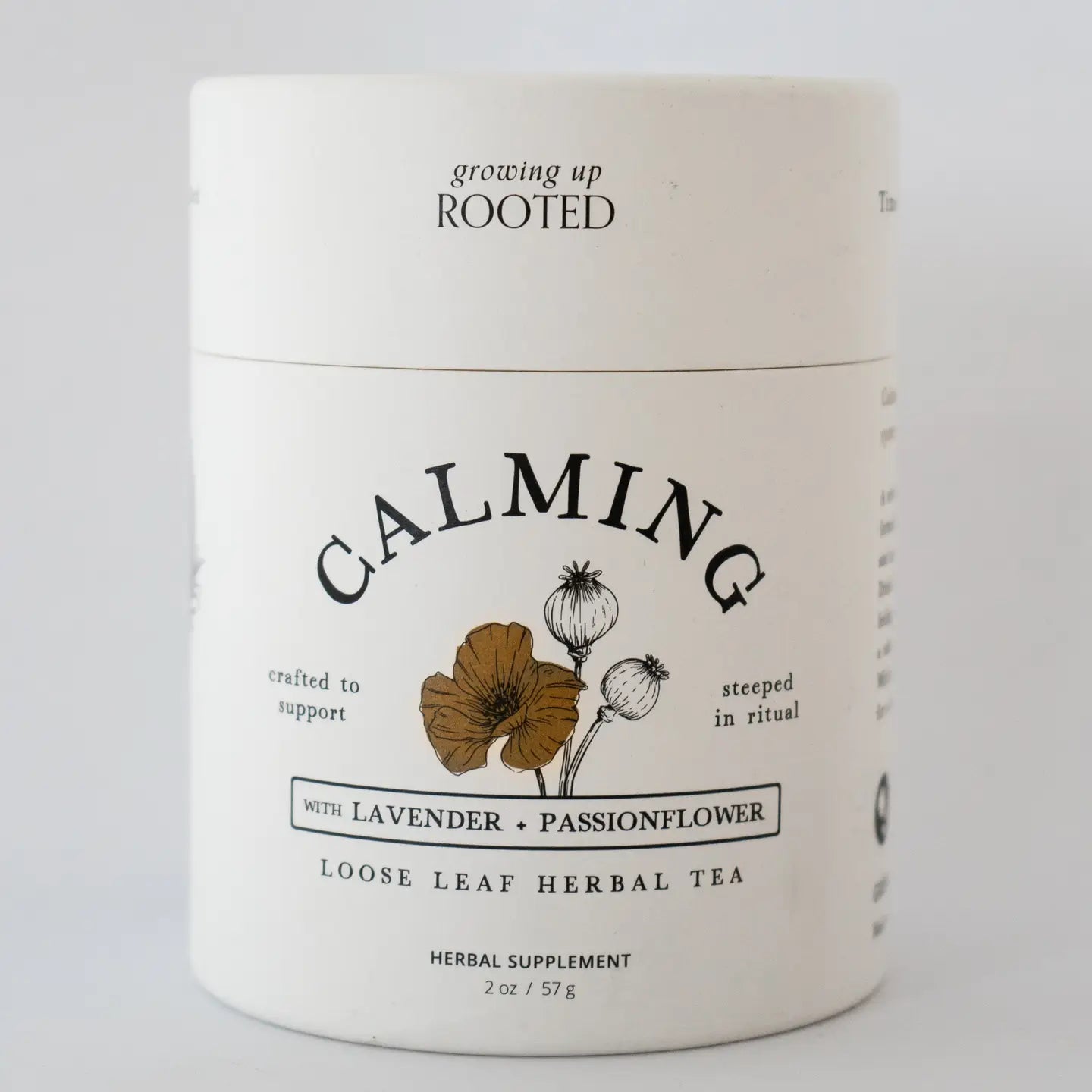 Container of 'Growing Up Rooted' Calming Loose Leaf Herbal Tea on a white background