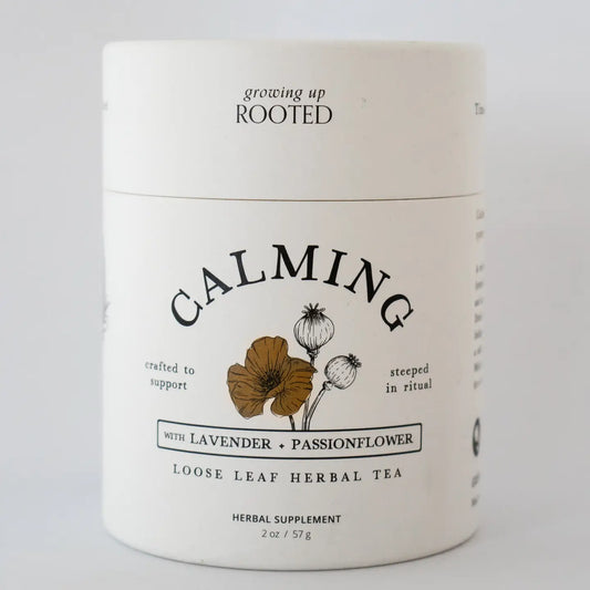 Container of 'Growing Up Rooted' Calming Loose Leaf Herbal Tea on a white background